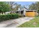 House exterior with driveway and hedges at 1103 Errol Place Cir, Apopka, FL 32712