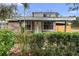House exterior with stone facade and hedges at 1103 Errol Place Cir, Apopka, FL 32712