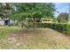 Landscaped front yard with mature trees and shrubs at 1103 Errol Place Cir, Apopka, FL 32712
