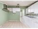 Updated kitchen with white cabinets and tile floors at 1103 Errol Place Cir, Apopka, FL 32712