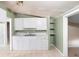 Updated kitchen with white cabinets and tile floors at 1103 Errol Place Cir, Apopka, FL 32712
