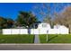 Front view of charming house with white fence at 1202 Dewey Ave, Orlando, FL 32808