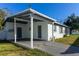 Covered patio and carport add to this home's appeal at 1202 Dewey Ave, Orlando, FL 32808