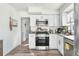 Modern kitchen with white cabinets and granite countertops at 1202 Dewey Ave, Orlando, FL 32808