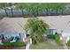Aerial view of the townhome featuring outdoor patio spaces with tropical landscaping at 1207 Lucaya Cir, Orlando, FL 32824