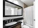 Bathroom with black granite vanity and shower/tub combo at 1207 Lucaya Cir, Orlando, FL 32824