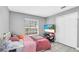 Bright bedroom with a queen bed and a large window at 1207 Lucaya Cir, Orlando, FL 32824