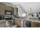 Modern kitchen featuring granite countertops and stainless steel appliances at 1207 Lucaya Cir, Orlando, FL 32824