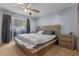 Spacious bedroom with wood platform bed, ceiling fan, and sliding glass doors at 121 Hidden Arbor Ct, Sanford, FL 32773