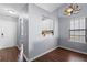 Cozy dining area with wood flooring and a pass-through to the kitchen at 121 Hidden Arbor Ct, Sanford, FL 32773