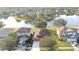 Aerial view of a house near a lake in a residential area at 12755 Oulton Cir, Orlando, FL 32832