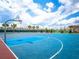 Community basketball court with blue and red surface at 12755 Oulton Cir, Orlando, FL 32832