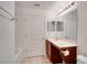 Clean bathroom with a double vanity, bathtub, and tiled floors at 12755 Oulton Cir, Orlando, FL 32832