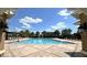 Community swimming pool with lounge chairs at 12755 Oulton Cir, Orlando, FL 32832