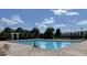 Community swimming pool with surrounding lounge chairs at 12755 Oulton Cir, Orlando, FL 32832