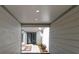 Covered entryway with clean lines, neutral colors, and a tidy walkway to the front door at 203 Red Bud Ln, Longwood, FL 32779