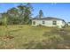 Spacious backyard with lush grass and home at 208 Goldenrod Ln, Kissimmee, FL 34759