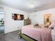 Main bedroom with a large bed and TV above fireplace at 208 Goldenrod Ln, Kissimmee, FL 34759