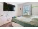 Bedroom with a double bed and mounted television at 208 Goldenrod Ln, Kissimmee, FL 34759