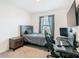 Bright bedroom with double bed, workspace, and ample closet space at 208 Goldenrod Ln, Kissimmee, FL 34759