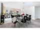 Modern dining area with black chairs and glass table at 208 Goldenrod Ln, Kissimmee, FL 34759