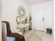 Bright entryway with console table, mirror, and comfy chair at 208 Goldenrod Ln, Kissimmee, FL 34759