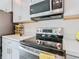 Modern kitchen with stainless steel range and microwave at 208 Goldenrod Ln, Kissimmee, FL 34759