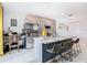 Modern kitchen with stainless steel appliances and an island at 208 Goldenrod Ln, Kissimmee, FL 34759
