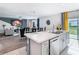 Modern kitchen with island, view of backyard at 208 Goldenrod Ln, Kissimmee, FL 34759