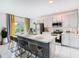 Modern kitchen with island and stainless steel appliances at 208 Goldenrod Ln, Kissimmee, FL 34759