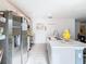 Modern kitchen with stainless steel appliances and island at 208 Goldenrod Ln, Kissimmee, FL 34759