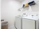 Laundry room with washer, dryer, and shelving at 208 Goldenrod Ln, Kissimmee, FL 34759