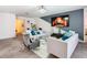 Living room with gray sofas, a fireplace TV and stylish decor at 208 Goldenrod Ln, Kissimmee, FL 34759