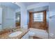 Clean bathroom with granite vanity, tiled shower/tub combo at 209 Meadow Hills Dr, Sanford, FL 32773