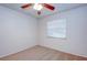 Spacious bedroom with a ceiling fan and large window with blinds at 209 Meadow Hills Dr, Sanford, FL 32773