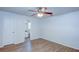 Spacious bedroom with wood-look flooring and ceiling fan at 209 Meadow Hills Dr, Sanford, FL 32773