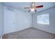 Bright bedroom with ceiling fan, window coverings, and ample closet space at 209 Meadow Hills Dr, Sanford, FL 32773
