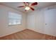 Bedroom with ceiling fan, window, closet and neutral wall color at 209 Meadow Hills Dr, Sanford, FL 32773