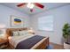 Cozy bedroom with ceiling fan, natural wood accents and plenty of natural light at 209 Meadow Hills Dr, Sanford, FL 32773