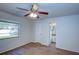 Bedroom with wood-look flooring, ceiling fan and en-suite bathroom at 209 Meadow Hills Dr, Sanford, FL 32773
