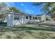 House exterior with light gray paint, lawn and driveway at 209 Meadow Hills Dr, Sanford, FL 32773