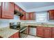 Recently updated kitchen with wood cabinets and granite countertops at 209 Meadow Hills Dr, Sanford, FL 32773