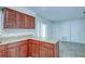 L-shaped kitchen with granite countertops and ample cabinet space at 209 Meadow Hills Dr, Sanford, FL 32773