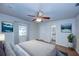 Relaxing main bedroom with wood floors, neutral walls and a view to the ensuite bathroom at 209 Meadow Hills Dr, Sanford, FL 32773