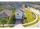 Two-story house with driveway, located in a residential neighborhood at 2910 Black Birch Dr, Ocoee, FL 34761