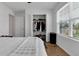 Bedroom with a full-size bed, walk-in closet, and wood floors at 2910 Black Birch Dr, Ocoee, FL 34761
