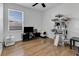 Bedroom with cat tree, TV, and wood flooring at 2910 Black Birch Dr, Ocoee, FL 34761
