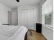 Bedroom with a full-size bed, double door closet, and wood floors at 2910 Black Birch Dr, Ocoee, FL 34761