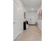 Bright and airy entryway with tile flooring and modern console table at 2910 Black Birch Dr, Ocoee, FL 34761