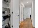 Hallway with linen closet and light wood flooring at 2910 Black Birch Dr, Ocoee, FL 34761